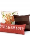 Adorned with the classic Live Love Laugh phrase, this decorative pillow from Martha Stewart Collection features an array of floral designs on a vibrant red backdrop for a whimsical allure. Finished with ball tassel trim.