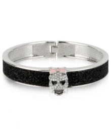 A look to die for. Betsey Johnson's hinged bangle bracelet features black glitter details and glass crystal accents in the form of a spruced-up skull for a fun effect. Approximate diameter: 2-1/4 inches. A look to die for. Betsey Johnson's hinged bangle bracelet features black glitter details and glass crystal accents in the form of a spruced-up skull for a fun effect. Approximate diameter: 2-1/4 inches.