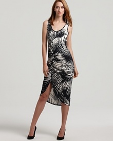 A high-contrast print of palm leaves in black and white, alluring ruching, and a dramatic side slit add up to a powerful presence in this Karen Kane dress. A high-contrast print of palm leaves in black and white, alluring ruching, and a dramatic side slit add up to a powerful presence in this Karen Kane dress.