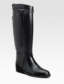 Riding style in waterproof rubber with strap and buckle detail.Shaft, 16½ Leg circumference, 15 Round toe Pull-on style Rubber sole Made in ItalyOUR FIT MODEL RECOMMENDS ordering true whole size; ½ sizes should order the next whole size up. Riding style in waterproof rubber with strap and buckle detail.Shaft, 16½ Leg circumference, 15 Round toe Pull-on style Rubber sole Made in ItalyOUR FIT MODEL RECOMMENDS ordering true whole size; ½ sizes should order the next whole size up.