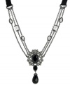 A refined design. T Tahari's Crystal Elegance collection necklace features a dramatic triple chain silhouette. Adorned with grosgrain ribbon, hand-face jet crystals and sparkling crystal accents, it's made in nickel-free hematite tone mixed metal. Approximate length: 24 inches + 4-inch extender. Approximate drop: 3-3/4 inches.