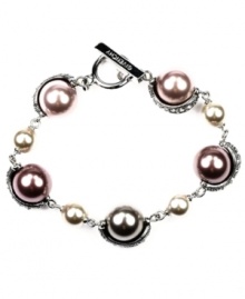 Smart mauve. With its versatile style that works for weekdays and weekends, investing in Givenchy's fashionable flex bracelet is a wise decision. Embellished with glass pearls in a pretty purple hue, it's set in silver tone mixed metal. Includes a toggle closure. Approximate length: 7-1/4 inches. Smart mauve. With its versatile style that works for weekdays and weekends, investing in Givenchy's fashionable flex bracelet is a wise decision. Embellished with glass pearls in a pretty purple hue, it's set in silver tone mixed metal. Includes a toggle closure. Approximate length: 7-1/4 inches.