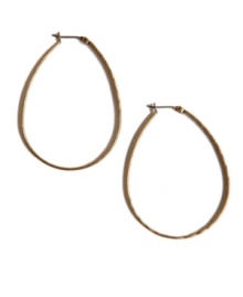 Instantly transform a dull ensemble with head-turning hoops. Lucky Brand design features an oblong-shaped hoop in gold tone mixed metal. Approximate diameter: 1-3/4 inches. Instantly transform a dull ensemble with head-turning hoops. Lucky Brand design features an oblong-shaped hoop in gold tone mixed metal. Approximate diameter: 1-3/4 inches.