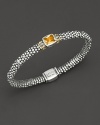 From the Glacier collection, thin caviar rope bracelet with centered citrine stone and gold accents. Designed by Lagos.
