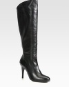 Sleek, soft nappa leather knee-high is given the added comfort of a stretch back inset for a perfect fit.Self-covered heel, 2¾ (65mm)Shaft, 14½Leg circumference, 13Leather upperLeather liningPadded insoleExclusive flexible rubber soleMade in Spain