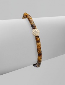 Beautifully textured tiger's eye-inspired beads accented with a rhinestone encrusted bead and a logo detailed tag. Epoxy beadsGlass stonesGoldtone brassDiameter, about 2¼ stretchableSlip-on styleImported Beautifully textured tiger's eye-inspired beads accented with a rhinestone encrusted bead and a logo detailed tag. Epoxy beadsGlass stonesGoldtone brassDiameter, about 2¼ stretchableSlip-on styleImported