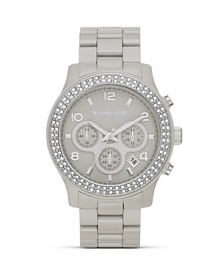 Surrender to sparkle with this Swarovski crystal-rimmed watch from MICHAEL Michael Kors, boasting an oversized case and pace-setting chronograph movement. Surrender to sparkle with this Swarovski crystal-rimmed watch from MICHAEL Michael Kors, boasting an oversized case and pace-setting chronograph movement.