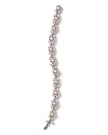 Organic manmade pearls are paired with sparkling cubic zirconia embellished butterflies in this elegant bracelet from Majorica. Organic manmade pearls are paired with sparkling cubic zirconia embellished butterflies in this elegant bracelet from Majorica.