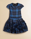 She'll be mad about plaid in this tartan-inspired frock with Peter Pan collar, pleated waistband and full, embroidered skirt.Peter Pan collarCap sleevesBack zipperPleated waistFull skirt with rosettes65% polyester/35% viscoseDry cleanImported