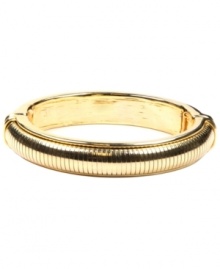 A simple, subtle addition for instant style. AK Anne Klein's textured stretch bracelet slips effortlessly over the wrist. Crafted in gold-plated mixed metal. Approximate diameter: 2-1/4 inches. A simple, subtle addition for instant style. AK Anne Klein's textured stretch bracelet slips effortlessly over the wrist. Crafted in gold-plated mixed metal. Approximate diameter: 2-1/4 inches.