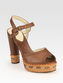 Intricately stitched leather platform with braided leather trim and an adjustable ankle strap. Self-covered heel, 4½ (115mm)Stitched leather platform, 1 (25mm)Compares to a 3½ heel (90mm)Leather upperLeather lining and solePadded insoleMade in ItalyOUR FIT MODEL RECOMMENDS ordering true size. Intricately stitched leather platform with braided leather trim and an adjustable ankle strap. Self-covered heel, 4½ (115mm)Stitched leather platform, 1 (25mm)Compares to a 3½ heel (90mm)Leather upperLeather lining and solePadded insoleMade in ItalyOUR FIT MODEL RECOMMENDS ordering true size.