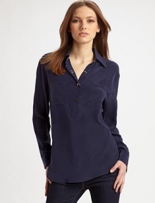 Classic henley style reimagined in fine silk with an easy, oversized shape and convertible sleeves.Point collar Partial front snap placket Long sleeves with snap cuffs convert to ¾ sleeves with button tabs Front patch pockets Shirttail hem Center back box pleat Back seaming with cutout detail About 27 from shoulder to hem Silk; dry clean Imported Classic henley style reimagined in fine silk with an easy, oversized shape and convertible sleeves.Point collar Partial front snap placket Long sleeves with snap cuffs convert to ¾ sleeves with button tabs Front patch pockets Shirttail hem Center back box pleat Back seaming with cutout detail About 27 from shoulder to hem Silk; dry clean Imported