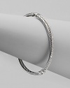 From the Silver Ice Crossover Collection. A twisted cable crisscrosses a diamond band in this graceful bangle of sterling silver and 14k white gold. Diamonds, 0.49 tcw Sterling silver and 14k white gold Diameter, about 2¼ Made in USA