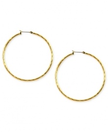Embellished elegance. Anne Klein adds glass accents to these hoop earrings crafted from gold-tone mixed metal to stunning effect. Approximate diameter: 2 inches. Embellished elegance. Anne Klein adds glass accents to these hoop earrings crafted from gold-tone mixed metal to stunning effect. Approximate diameter: 2 inches.