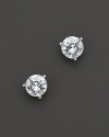Three prong diamond stud earrings in a platinum martini setting.