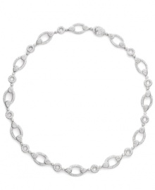 Traditional yet trendy! A link design makes Eliot Danori's collar necklace classically chic, while sparkling crystals give it a modern makeover. Set in silver tone mixed metal, it's the best of both worlds. Approximate length: 16 inches. Traditional yet trendy! A link design makes Eliot Danori's collar necklace classically chic, while sparkling crystals give it a modern makeover. Set in silver tone mixed metal, it's the best of both worlds. Approximate length: 16 inches.