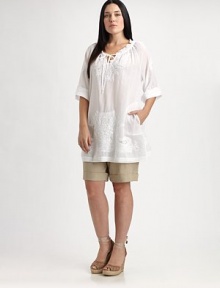 Thanks to its chic, roll-tab sleeves and relaxed fit, this cotton design offers a flattering, ultra-feminine fit. Plus, you will not be able to resist its gorgeous embroidery.Self-tie detail at ruched necklineRoll-tab sleevesLovely embellished detailsPull-on styleAbout 34 from shoulder to hemCottonDry cleanImported Thanks to its chic, roll-tab sleeves and relaxed fit, this cotton design offers a flattering, ultra-feminine fit. Plus, you will not be able to resist its gorgeous embroidery.Self-tie detail at ruched necklineRoll-tab sleevesLovely embellished detailsPull-on styleAbout 34 from shoulder to hemCottonDry cleanImported