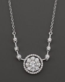 Diamond flower cluster pendant with bezel stations on the chain. Set in 14 Kt. white gold. Diamond flower cluster pendant with bezel stations on the chain. Set in 14 Kt. white gold.