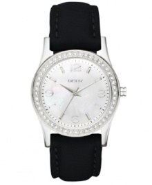 Featuring a serene dial, this DKNY timepiece eases the passage of time. Featuring a serene dial, this DKNY timepiece eases the passage of time.