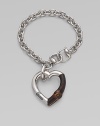 From the Bamboo Collection. A study in contrasts with this sterling silver and bamboo heart charm on a rolo chain. Sterling silver Lenth, about 7¼ Pendant width, about 2 Lobster clasp closure Made in Italy 