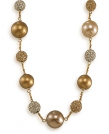 Follow the golden rule with this glamorous illusion necklace. Crafted by Carolee, necklace features gold glass pearls and crystal glass stones. Set in 12k gold-plated mixed metal. Approximate length: 16 inches + 2-inch extender. Follow the golden rule with this glamorous illusion necklace. Crafted by Carolee, necklace features gold glass pearls and crystal glass stones. Set in 12k gold-plated mixed metal. Approximate length: 16 inches + 2-inch extender.
