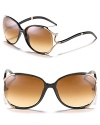 Round oversized sunglasses with metal snake detail that twists and turns along temples for a unique style.