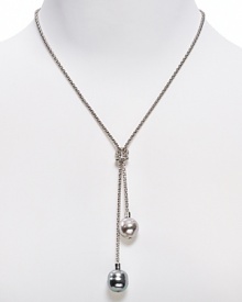 Single strand lariat chain necklace from Majorica with love knot and two opaque beads. Single strand lariat chain necklace from Majorica with love knot and two opaque beads.