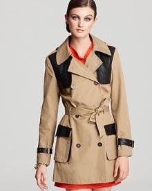 Sleek black leather creates cool color-blocking on this Rebeca Minkoff trench, an edgy take on the classic style. No longer just for inclement wear, rock this modern look-bold with utility details-any day or night as fall approaches. Sleek black leather creates cool color-blocking on this Rebeca Minkoff trench, an edgy take on the classic style. No longer just for inclement wear, rock this modern look-bold with utility details-any day or night as fall approaches.