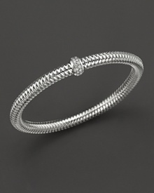 A row of diamonds binds this woven 18K white gold bracelet from Roberto Coin. A row of diamonds binds this woven 18K white gold bracelet from Roberto Coin.