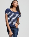 A refreshing spring begins with this luxe Joie crop top, smart in navy and white for a nautical look you're going to love. Complementing everything from skinny jeans to pleated skirts, this favorite style is a basic must.