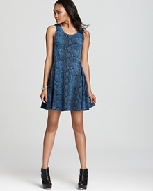 A slithering snake print adorns a youthful skater silhouette on Aqua's ponte knit, everyday-wear dress. A slithering snake print adorns a youthful skater silhouette on Aqua's ponte knit, everyday-wear dress.