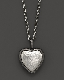 A hammered sterling silver heart makes a romantic, modern statement. A hammered sterling silver heart makes a romantic, modern statement.