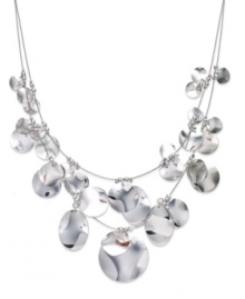 Put your chips on the table with this illusion necklace from Sequin. Two rows string shimmering pendants in a rounded design. Crafted in silver tone mixed metal. Approximate length: 17 inches + 3-inch extender. Put your chips on the table with this illusion necklace from Sequin. Two rows string shimmering pendants in a rounded design. Crafted in silver tone mixed metal. Approximate length: 17 inches + 3-inch extender.