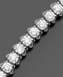 Elevate elegance with a seemingly endless display of diamonds. This beautiful diamond bracelet features round-cut diamonds (6 ct. t.w.) set in 14k white gold. 6 carat diamond bracelet approximate length: 7 inches. Elevate elegance with a seemingly endless display of diamonds. This beautiful diamond bracelet features round-cut diamonds (6 ct. t.w.) set in 14k white gold. 6 carat diamond bracelet approximate length: 7 inches.