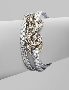 From the Naga Collection. A braid of rich leather wraps the wrist three times while weaving in and out of a curvaceous silver dragon.LeatherSterling silverLength, about 6½Lobster claspMade in Bali From the Naga Collection. A braid of rich leather wraps the wrist three times while weaving in and out of a curvaceous silver dragon.LeatherSterling silverLength, about 6½Lobster claspMade in Bali