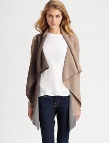 Neutral, lightweight and draped, this lengthy cashmere sweater is an essential piece for every season. Draped button frontLong sleevesAsymmetrical cropped back hemAbout 33 from shoulder to hem at longest pointCashmereDry cleanImportedModel shown is 5'11 (178cm) wearing US size Small. Neutral, lightweight and draped, this lengthy cashmere sweater is an essential piece for every season. Draped button frontLong sleevesAsymmetrical cropped back hemAbout 33 from shoulder to hem at longest pointCashmereDry cleanImportedModel shown is 5'11 (178cm) wearing US size Small.
