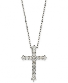 Sparkling and resplendent, this beautiful cross pendant features round-cut diamonds (1/4 ct. t.w.) set in 14k white gold. Approximate length: 16 inches. Approximate drop: 3/4 inches.