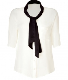 Elegant blouse in fine, pure cream silk - Soft, lightweight fabric drapes beautifully - Chic button down style with black tie neck and collar - Elbow-length sleeves and chest pocket - Slim, feminine silhouette tapers gently at waist - Polished to perfection, easily dressed up or down - Pair with a leather pencil skirt, skinny jeans or wide-leg trousers and platform pumps Elegant blouse in fine, pure cream silk - Soft, lightweight fabric drapes beautifully - Chic button down style with black tie neck and collar - Elbow-length sleeves and chest pocket - Slim, feminine silhouette tapers gently at waist - Polished to perfection, easily dressed up or down - Pair with a leather pencil skirt, skinny jeans or wide-leg trousers and platform pumps