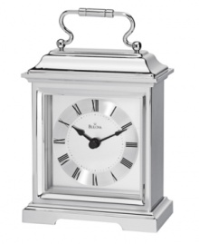 This formal carriage clock by Bulova adds elegance to an end table or side board. Rectangular spun and brushed aluminum case features a curved handle at top. Silver tone dial displays black Roman numerals and two hands. This formal carriage clock by Bulova adds elegance to an end table or side board. Rectangular spun and brushed aluminum case features a curved handle at top. Silver tone dial displays black Roman numerals and two hands.