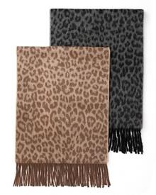 A black and grey leopard print cashmere scarf adds a fierce element to your winter wardrobe. A black and grey leopard print cashmere scarf adds a fierce element to your winter wardrobe.