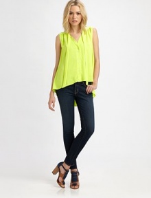 Vibrant silk makes a bold statement in breezy tie-front swing top.Tie-front collarSleevelessButton-down frontHem longer in backGathered back below yokeAbout 23 from shoulder to hemSilkDry cleanMade in USA of imported fabricModel shown is 5'10 (178cm) wearing US size Small. Vibrant silk makes a bold statement in breezy tie-front swing top.Tie-front collarSleevelessButton-down frontHem longer in backGathered back below yokeAbout 23 from shoulder to hemSilkDry cleanMade in USA of imported fabricModel shown is 5'10 (178cm) wearing US size Small.