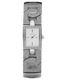 Lock in the style you love with this sparkly watch by DKNY. Crystal-accented stainless steel bracelet with logo openwork and rectangular case. Chrome mother-of-pearl dial with stick indices and logo. Quartz movement. Water resistant to 50 meters. Two-year limited warranty.