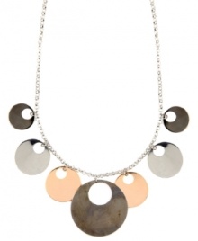 Out of this world. Striking cut-out circles create a unique orbital design on Nine West's shaky necklace. Set in silver, rose gold, and hematite-plated mixed metal. Approximate length: 17 inches + 2-inch extender. Approximate drop: 1-1/2 inches. Out of this world. Striking cut-out circles create a unique orbital design on Nine West's shaky necklace. Set in silver, rose gold, and hematite-plated mixed metal. Approximate length: 17 inches + 2-inch extender. Approximate drop: 1-1/2 inches.