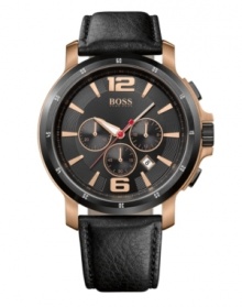 A hint of rosy tones grace the rich features of this precise timepiece made for the modern man, by Hugo Boss. Watch crafted of black leather strap and round rose-gold tone stainless steel case. Black bezel features engraved white numerals. Black chronograph dial features rose-gold tone applied numerals at twelve and six o'clock, stick indices, minute track, date window, three subdials, luminous hour and minute hands, red second hand and logo at twelve o'clock. Quartz movement. Water resistant to 100 meters. Two-year limited warranty. A hint of rosy tones grace the rich features of this precise timepiece made for the modern man, by Hugo Boss. Watch crafted of black leather strap and round rose-gold tone stainless steel case. Black bezel features engraved white numerals. Black chronograph dial features rose-gold tone applied numerals at twelve and six o'clock, stick indices, minute track, date window, three subdials, luminous hour and minute hands, red second hand and logo at twelve o'clock. Quartz movement. Water resistant to 100 meters. Two-year limited warranty.
