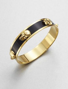 Shiny raised skulls on an enamel accented style. EnamelGoldtone brassDiameter, about 2.6Slip-on styleImported Shiny raised skulls on an enamel accented style. EnamelGoldtone brassDiameter, about 2.6Slip-on styleImported