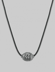 A rustic leather cord holds a sphere of hand-forged sterling silver with a weathered-look Star of David design.Leather Sterling silver Length, about 21 Hematite bead clasp Made in USA A rustic leather cord holds a sphere of hand-forged sterling silver with a weathered-look Star of David design.Leather Sterling silver Length, about 21 Hematite bead clasp Made in USA