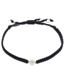 The perfect hint of sparkle. This trendy wrap bracelet features a round-cut cubic zirconia accent with a 14k gold bezel setting and accents. Cord crafted from braided black nylon. Approximate diameter: 2-1/4 inches (extends to 3-1/2 inches).