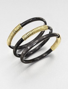 A set of three horn bangles wrapped in shiny brass wire. Recycled ankole cow hornRecycled brassDiameter, about 2.5Slip-on styleImported A set of three horn bangles wrapped in shiny brass wire. Recycled ankole cow hornRecycled brassDiameter, about 2.5Slip-on styleImported
