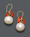 Sophistication and vibrant color all mixed into one. These artfully-crafted earrings feature a polished cultured freshwater pearl (9 mm) accented by bright coral ships. Crafted in 14k gold. Approximate drop: 1/2 inch.