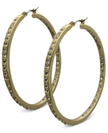 Fashion that covers all bases. These golden hoop earrings from GUESS sparkle both inside and out with glass accents. Crafted in gold tone mixed metal. Approximate drop: 2 inches. Fashion that covers all bases. These golden hoop earrings from GUESS sparkle both inside and out with glass accents. Crafted in gold tone mixed metal. Approximate drop: 2 inches.